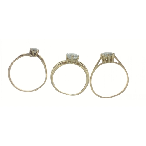 16 - Three 9ct hallmarked rings set with white stones, two size O/P the other size L, bands are slightly ... 