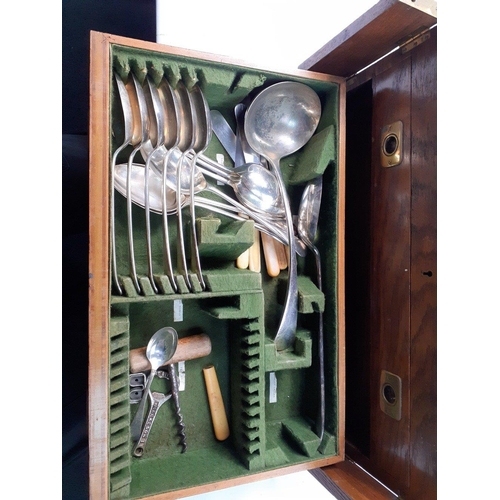 165 - A vintage three tier solid oak canteen to include plated cutlery including serving spoons, ladle, br... 