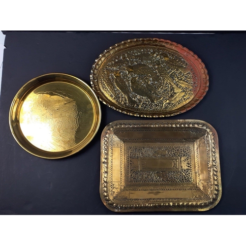 168 - Two Indian brass trays larger being 36x29cm approx plus one other.#168