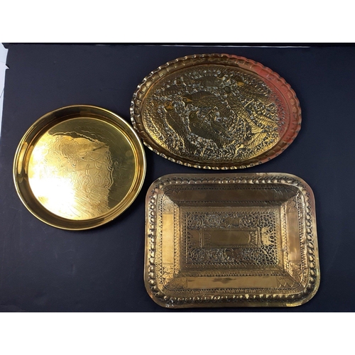 168 - Two Indian brass trays larger being 36x29cm approx plus one other.#168