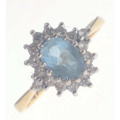 19 - A beautiful 750 stamped gold ring with 7mm approx aquamarine centre stone surround by 16 good diamon... 