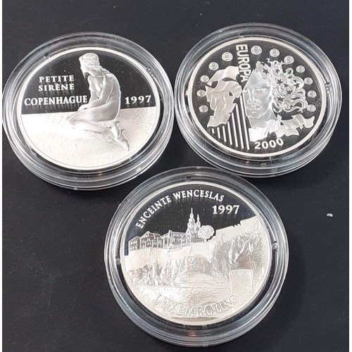 190 - Three beautiful MONNAIE DE PARIS silver proof coins each beautifully presented in a plush case with ... 