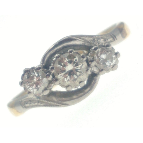 20 - An 18ct stamped gold / platinum ring with three lovely diamonds on twist shank.  Centre diamond 4mm ... 