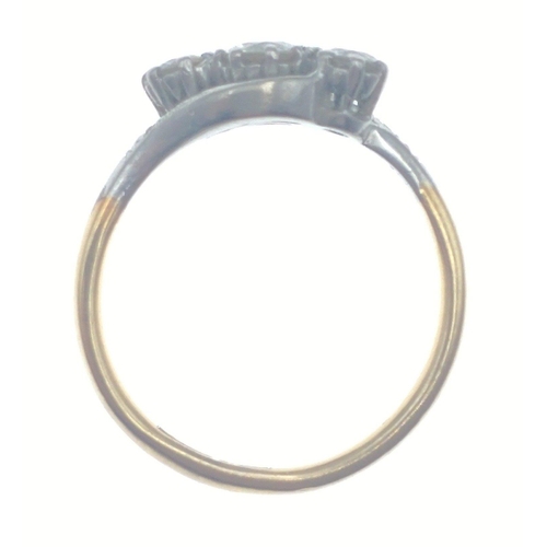 20 - An 18ct stamped gold / platinum ring with three lovely diamonds on twist shank.  Centre diamond 4mm ... 