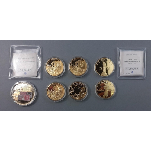 203 - A selection of Westminster Mint plated coins to include 1886 Liberty, Winston Churchill, Kitchener a... 