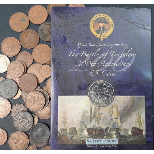 213 - A small collection of coins to include a carded Battle of Trafalgar £5 coin, and a quantity of ... 