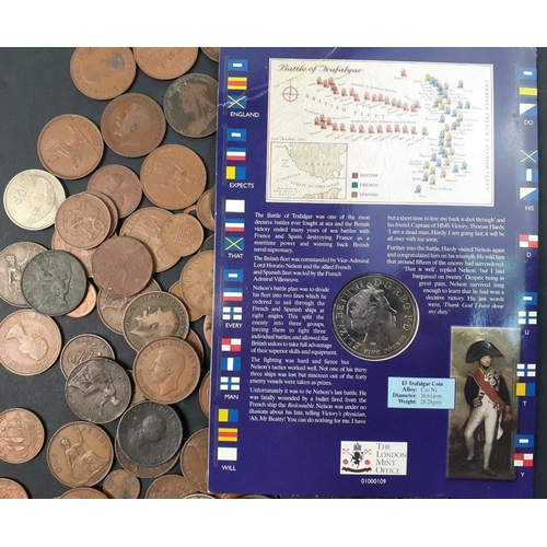 213 - A small collection of coins to include a carded Battle of Trafalgar £5 coin, and a quantity of ... 