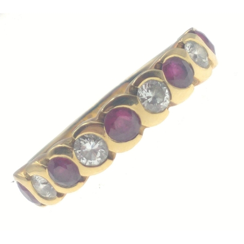 22 - A beautiful classic 18ct gold ring set with stunning rubies and diamonds (tested). Each stone measur... 