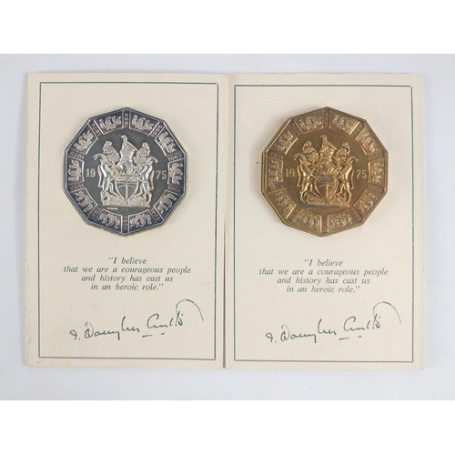 220 - Two superb Rhodesian Independence Medallions minted by Matthews.  One in pure silver - weighs 63g ap... 