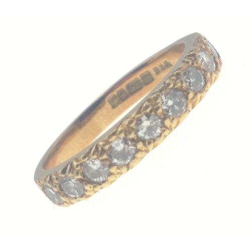 23 - A stunning 18 ct fully hallmarked gold ring inset with 9 x 2mm diamonds (tested). Size M, gross weig... 