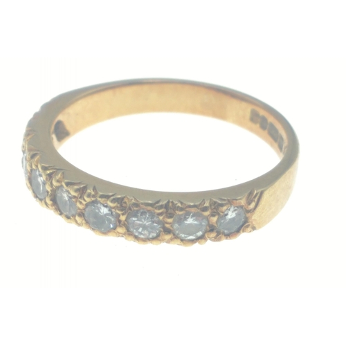 23 - A stunning 18 ct fully hallmarked gold ring inset with 9 x 2mm diamonds (tested). Size M, gross weig... 