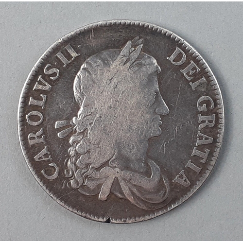 235 - CHARLES II 1662 Silver Crown in good collectible grade.  Wear to high spots and minor edge chip at 7... 