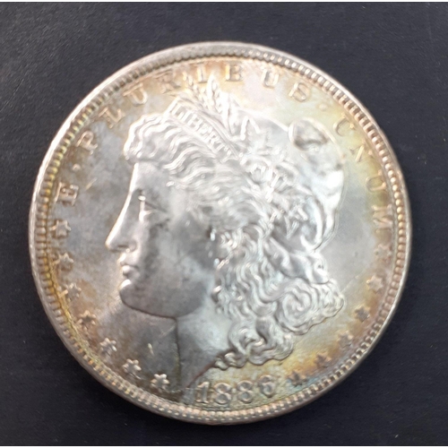 251 - 1886 UNITED STATES Morgan Dollar. Lightly toned, good grade.#251