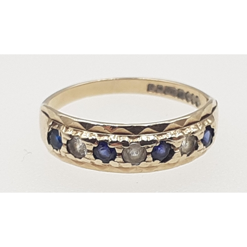 26 - A 375 stamped gold ring set with 4 sapphires and 3 diamonds (tested), size N, gross weight 1.9g appr... 