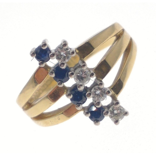 29 - A fully UK hallmarked 18ct gold ring by S&D, stamped Starlight (Singapore), with 4 offset sapphi... 