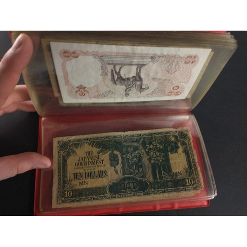 296 - An album containing world banknotes of interest to include Japanese Occupation note, China Hell note... 