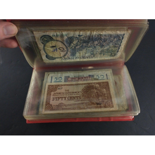 296 - An album containing world banknotes of interest to include Japanese Occupation note, China Hell note... 