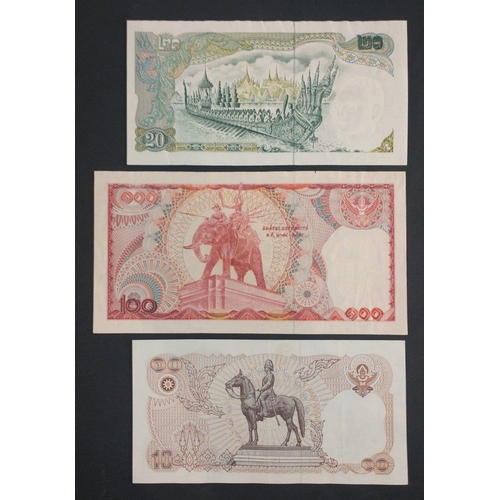 297 - A banknote album page containing three THAILAND banknotes of interest to include 100, 20, 10 Baht no... 