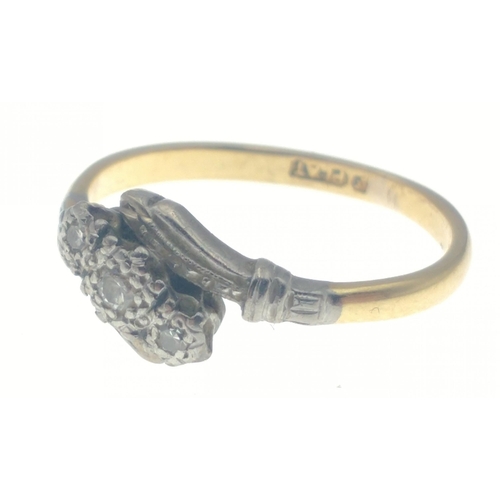 34 - A yellow metal ring marked PLAT possibly 18 PLAT, set with 3 diamonds (tested) size N, gross weight ... 