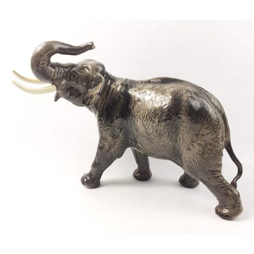 377 - A large BESWICK pottery elephant WITH TRUNK RAISED IN SALUTE, length 42cm x height 30cm approx - con... 