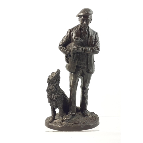 383 - A charming resin figurine of a shepherd with his collie and carrying a lamb, stamped ELPHICK 1979, s... 