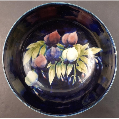 398 - A large Moorcroft fruit bowl with Moorcroft signature on base.  It is 24cm in diameter with an unfor... 