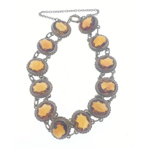 40 - A gorgeous 9ct fully hallmarked bracelet set with 12 superb amber stones.  Gross weight 18g approx 7... 