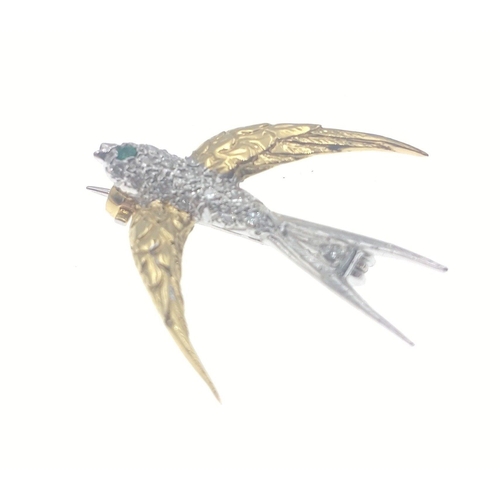 41 - A stunning SWALLOW shaped brooch stamped with full 750 GOLD hallmarks. A small emerald for the eye c... 