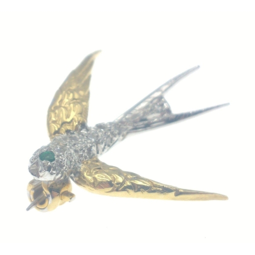 41 - A stunning SWALLOW shaped brooch stamped with full 750 GOLD hallmarks. A small emerald for the eye c... 