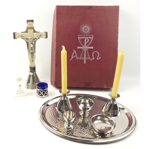 411 - A boxed vintage travelling communion set comprising a 33cm standing crucifix, small chalices, bowls ... 