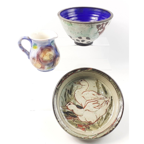 442 - Three pieces of studio ware to include a 22cm shallow bowl with ducks, a blue bowl and a 13cm jug#44... 