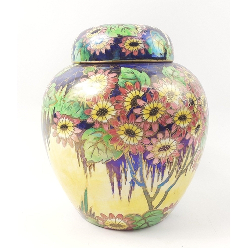 445 - A stunning and vibrant ginger jar with lustrous flowers - standing approximately 20cm tall- in beaut... 