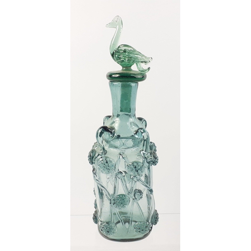 474 - A beautiful light green glass decanter with swan stopper standing 30cm tall.  In good order with ver... 