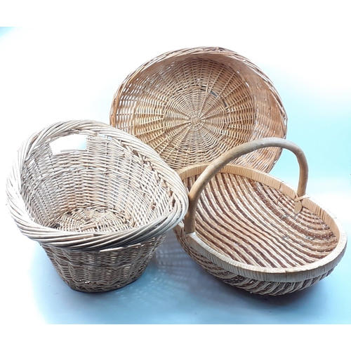 490 - Three very useful wicker baskets to include 1 cat basket style, a 2-handled laundry basket 59cm leng... 