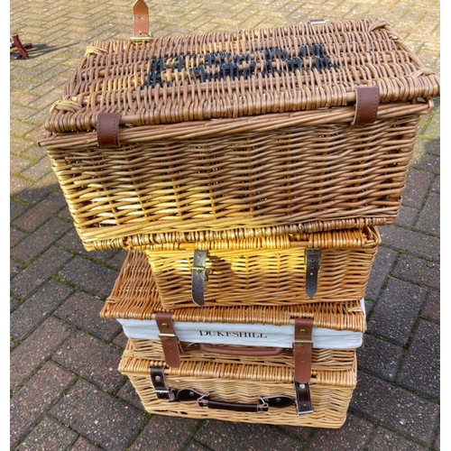 493 - A collection of 4 wicker lidded hamper baskets to include a FORTNUM & MASON#492