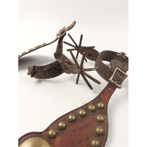 505 - A pair of antique spurs with leathers plus a pair of silvered spurs#504