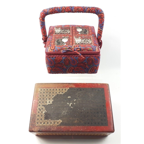 556 - For SEWING ENTHUSIASTS - a beautiful fabric and padded sewing basket and a sewing box with handle to... 