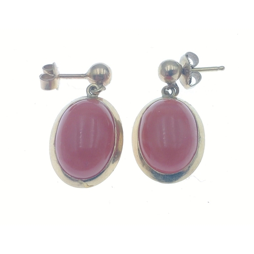 56 - A pair of 750 stamped drop earrings (20mm approx) with coral effect stone.  Gross weight 5.2g approx... 