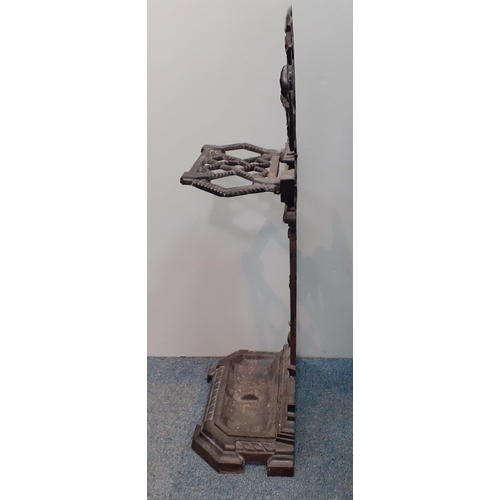 589 - A reproduction iron umbrella stand with dog's head decoration at top, standing 75cm high approx#588... 