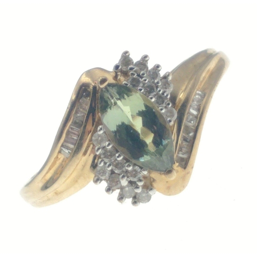 6 - A 9ct hallmarked ring set with an oval green stone surrounded by 2 rows of diamond chips (tested but... 