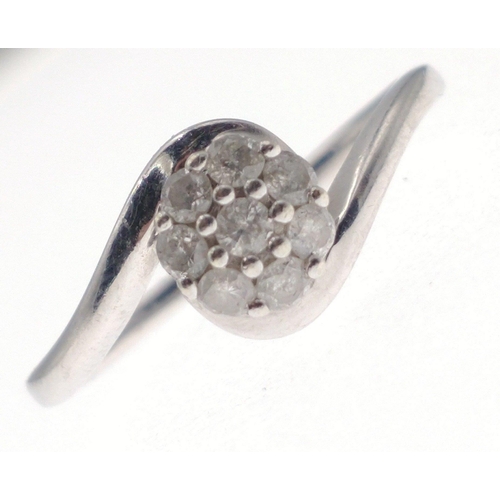 7 - A 375 hallmarked white gold ring set with 9 tested diamonds in a flower head pattern size N/O, gross... 