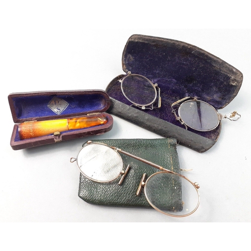 80 - Two pairs of antique pince-nez glasses in cases. A pretty little pair!  Lot includes a nicely case u... 