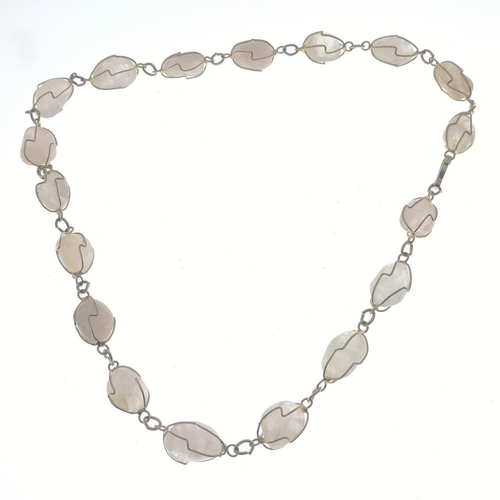 90 - A pretty necklace comprising 18 pearly coloured stones secured by wire, 44cm long approx#90