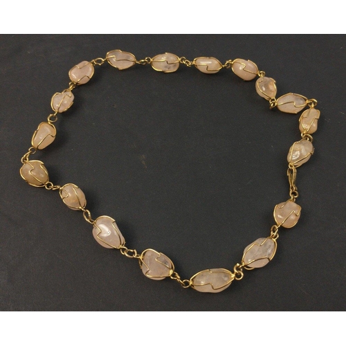 90 - A pretty necklace comprising 18 pearly coloured stones secured by wire, 44cm long approx#90