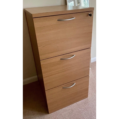 24 - A wooden three drawer filing cabinet with lock and key - to include some file folders within. 18
