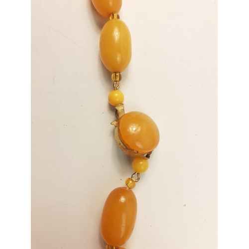 45 - A string of graduated sized amber style beads 60cm long approx#45