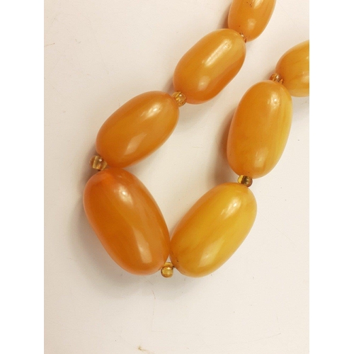 45 - A string of graduated sized amber style beads 60cm long approx#45