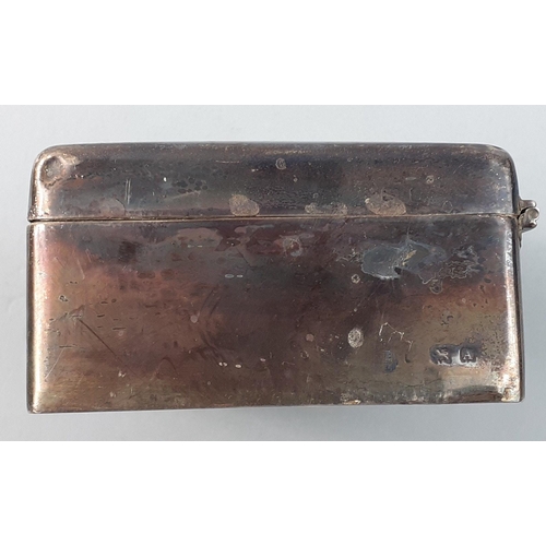 55 - A sterling silver hallmarked cigarette case with rubbed marks and damaged hinges.  Cedar wood lined ... 