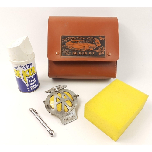 579 - A small automotive lot to include a FORD CAPRI leather de-icer case, an original vintage AA badge (6... 