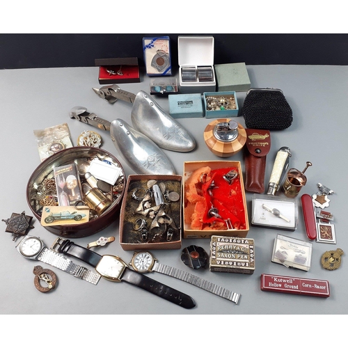 595 - A mixed lot to include pen nibs, coins, trinkets, watches, shoe lasts, napkin rings, and some milita... 